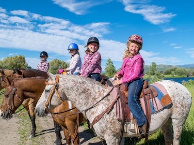 Group of girls horseback riding