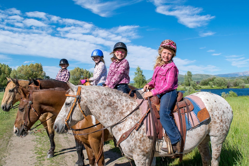 Group of girls horseback riding