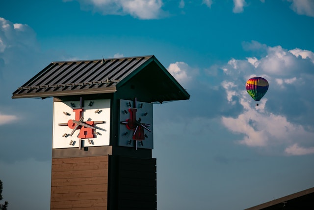 Tram Clock Tower with a hot air balloon in the distance