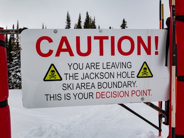 Caution sign on backcountry gates
