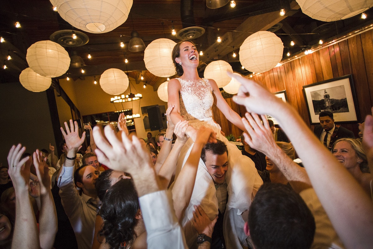Bride getting boosted up at her wedding