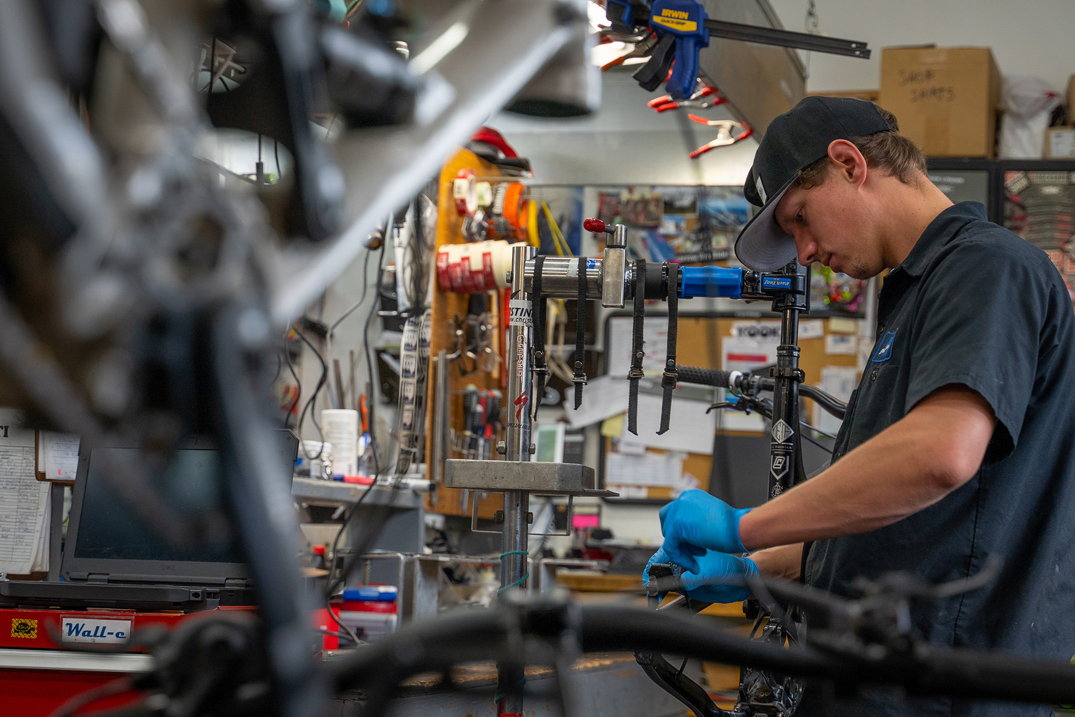 Hoback Sports employee tuning a bike