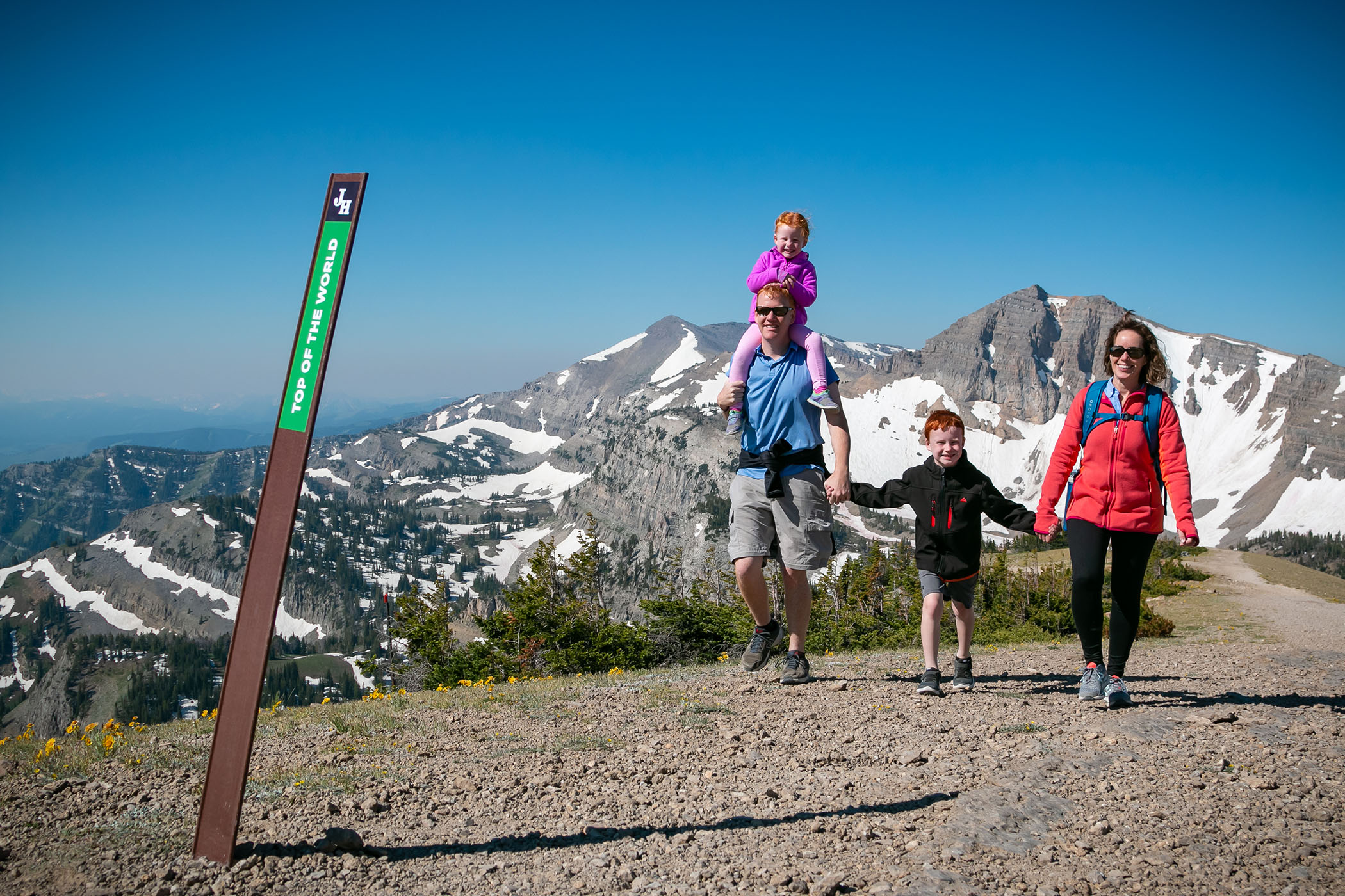 Family hiking on the Top of the World trail