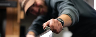Employee tuning a pair of skis