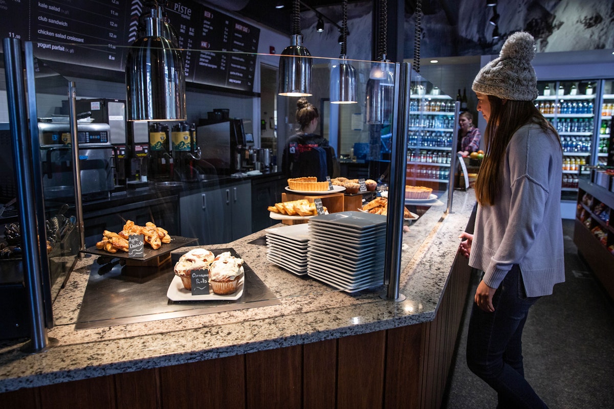 Woman looking at pizza in off piste