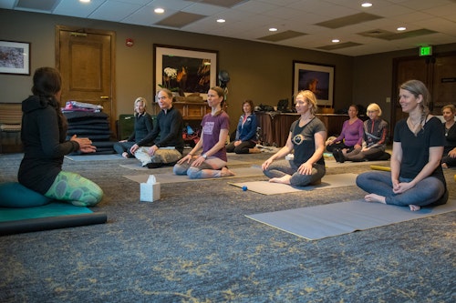 Group doing yoga at Mindful Ski Camp