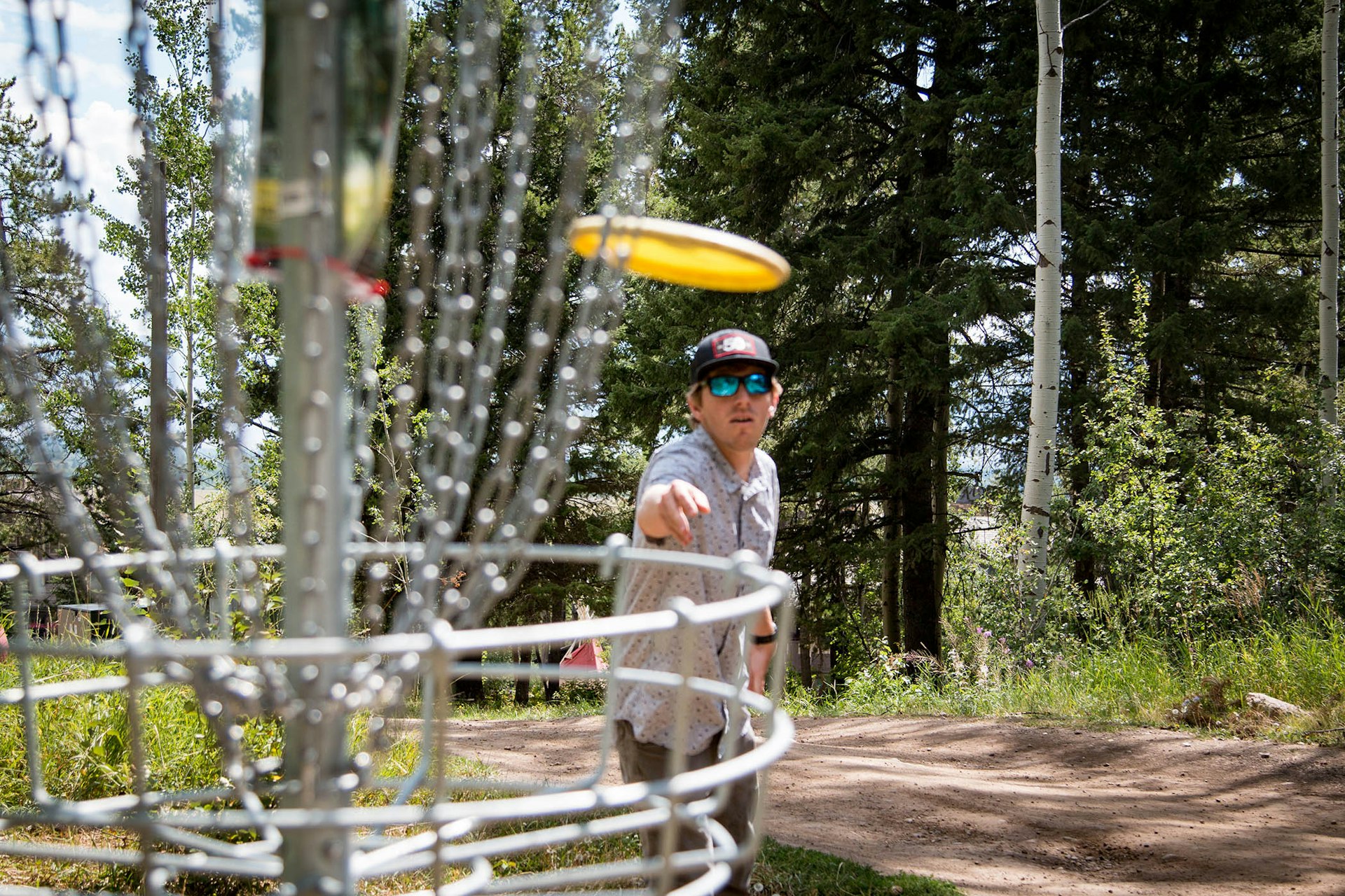 Thowing a disc into the basket