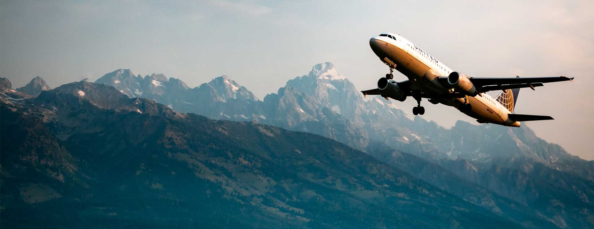 Airplane taking off at dusk