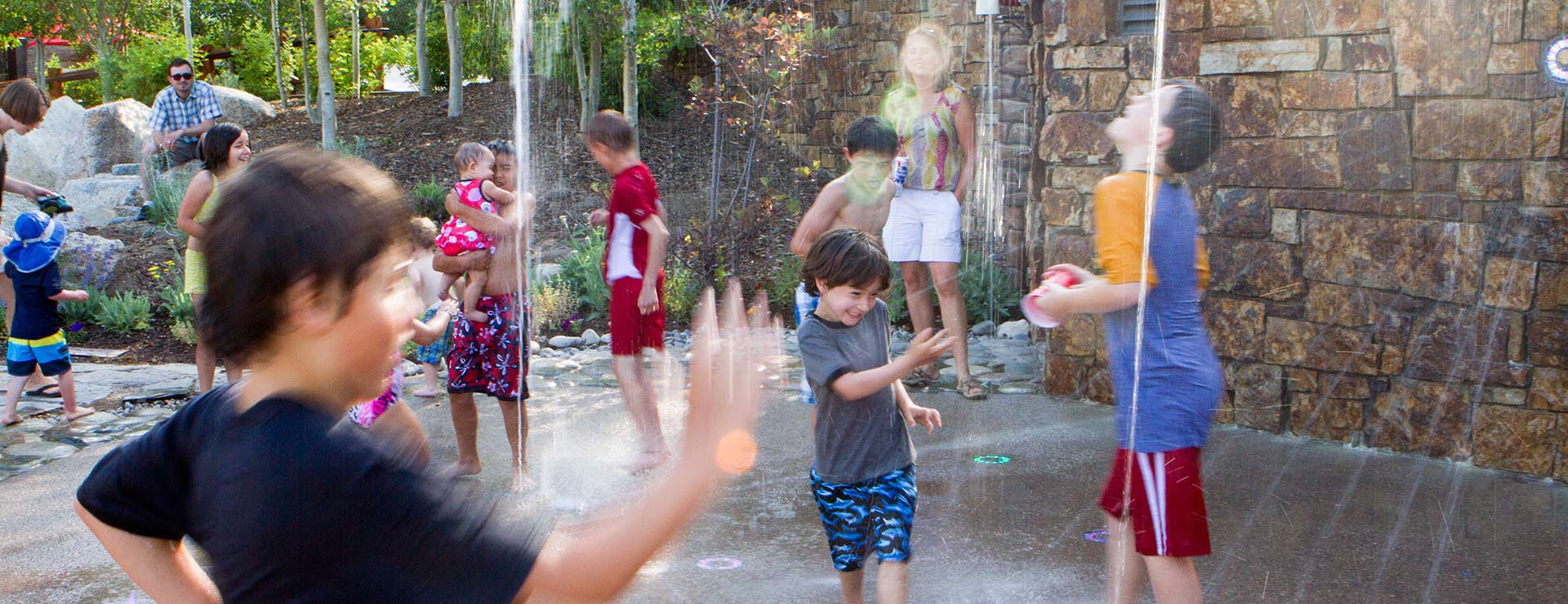 Kids enjoying the pop jets on a nice summer day