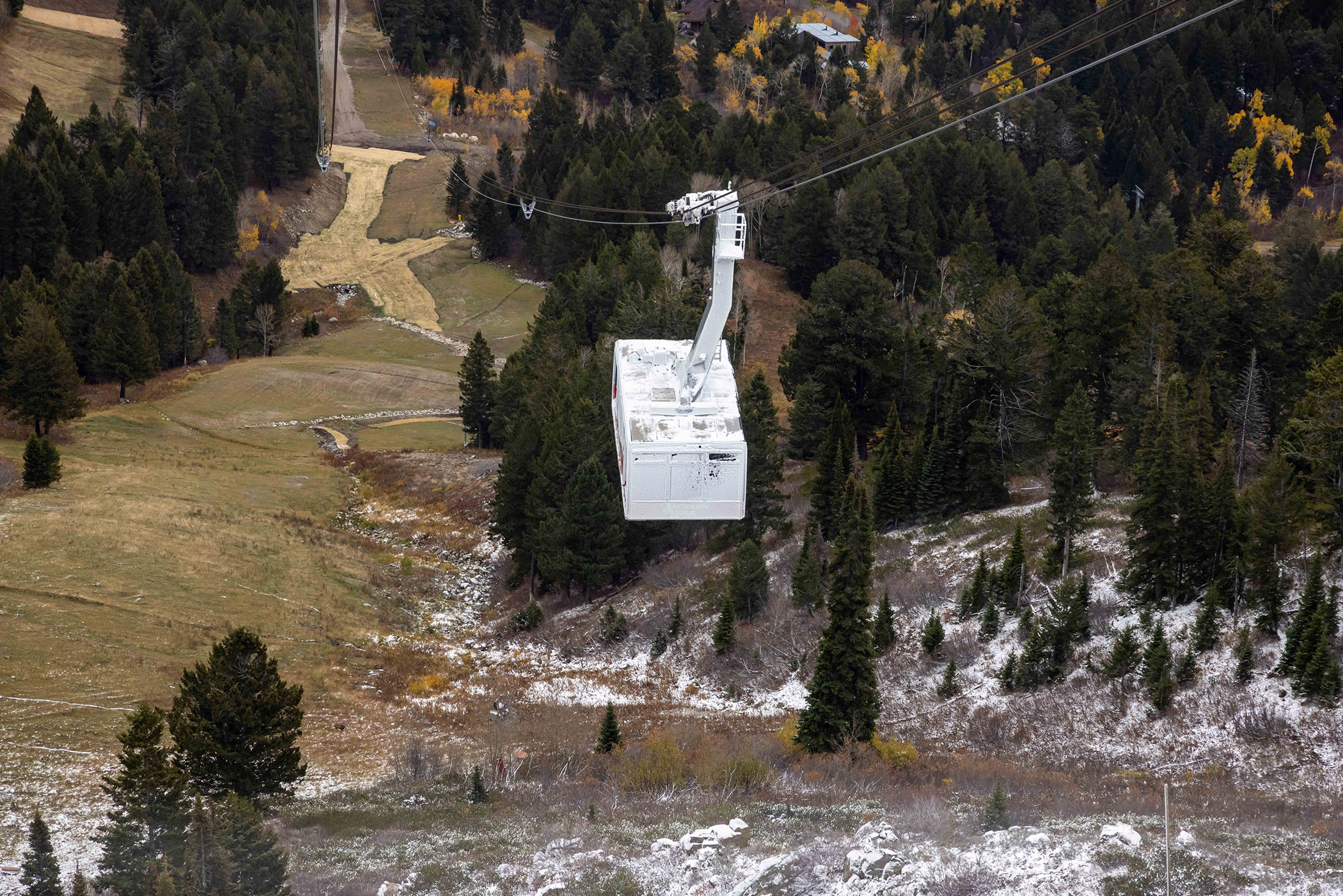 Snow covered Tram coming back up to the top