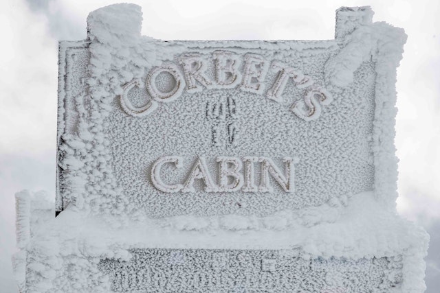 Iced over Corbet's Cabin  sign