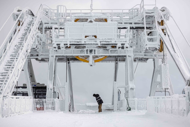 Lift operator digging out the Tram dock