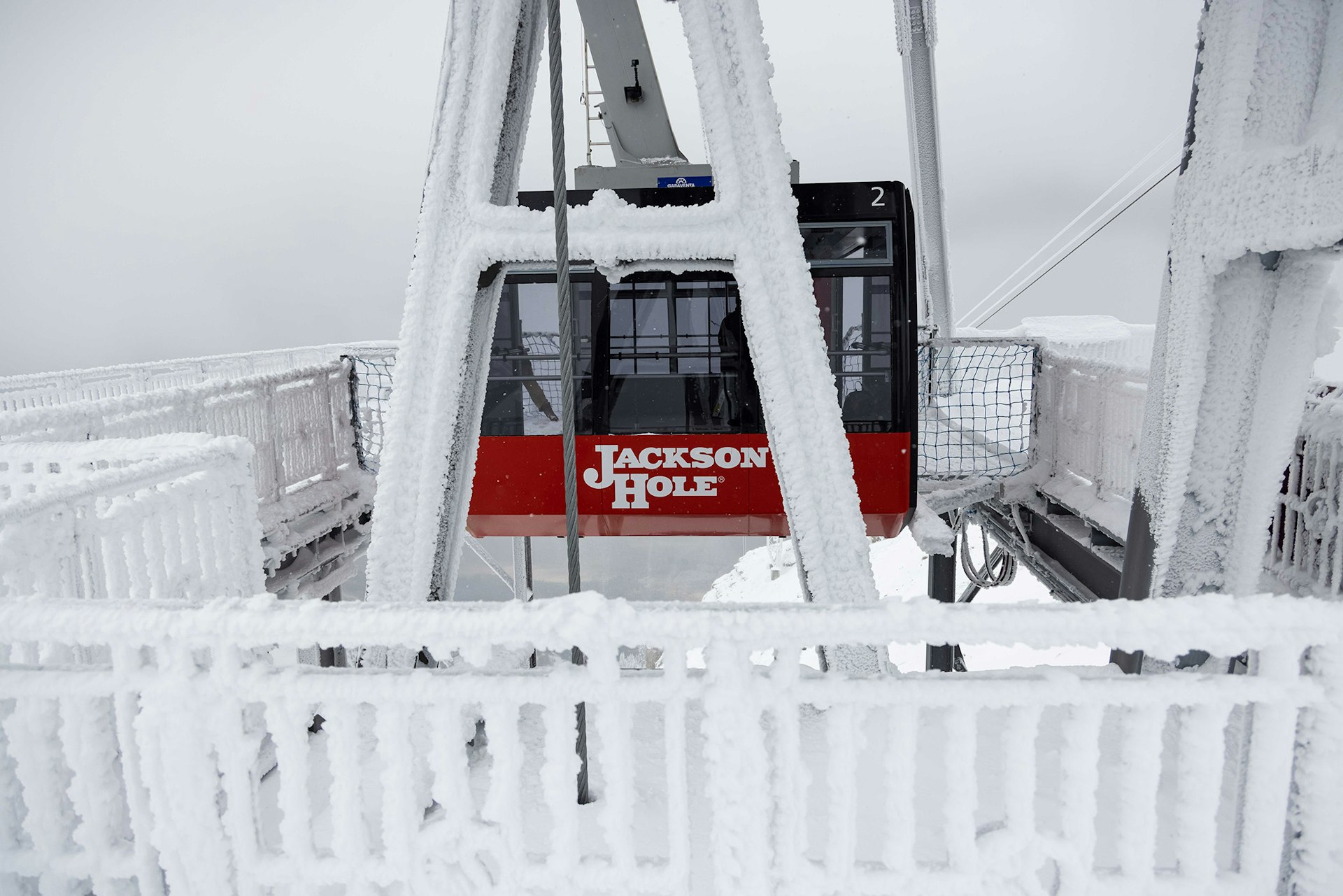 Snow covered Tram coming into the dock at the top