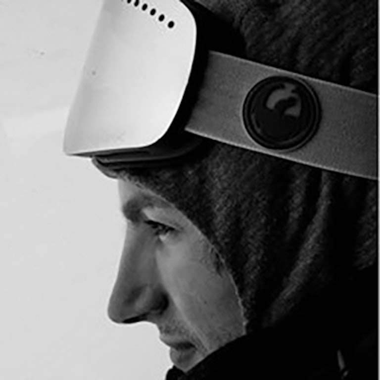 Yoder looking off into the distance in a beanie and googles