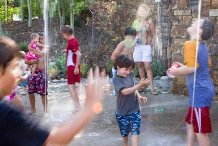 Kids having fun playing in the pop jets