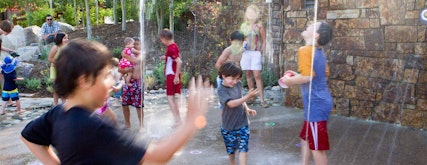 Kids having fun playing in the pop jets