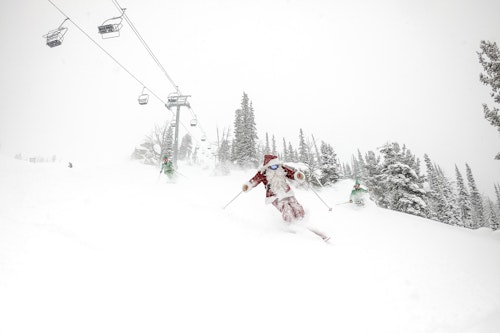 Santa skiing deep powder