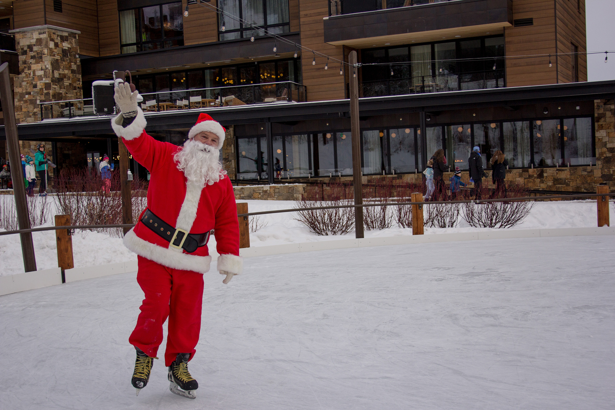 Santa skating on the rink in the Village Commons
