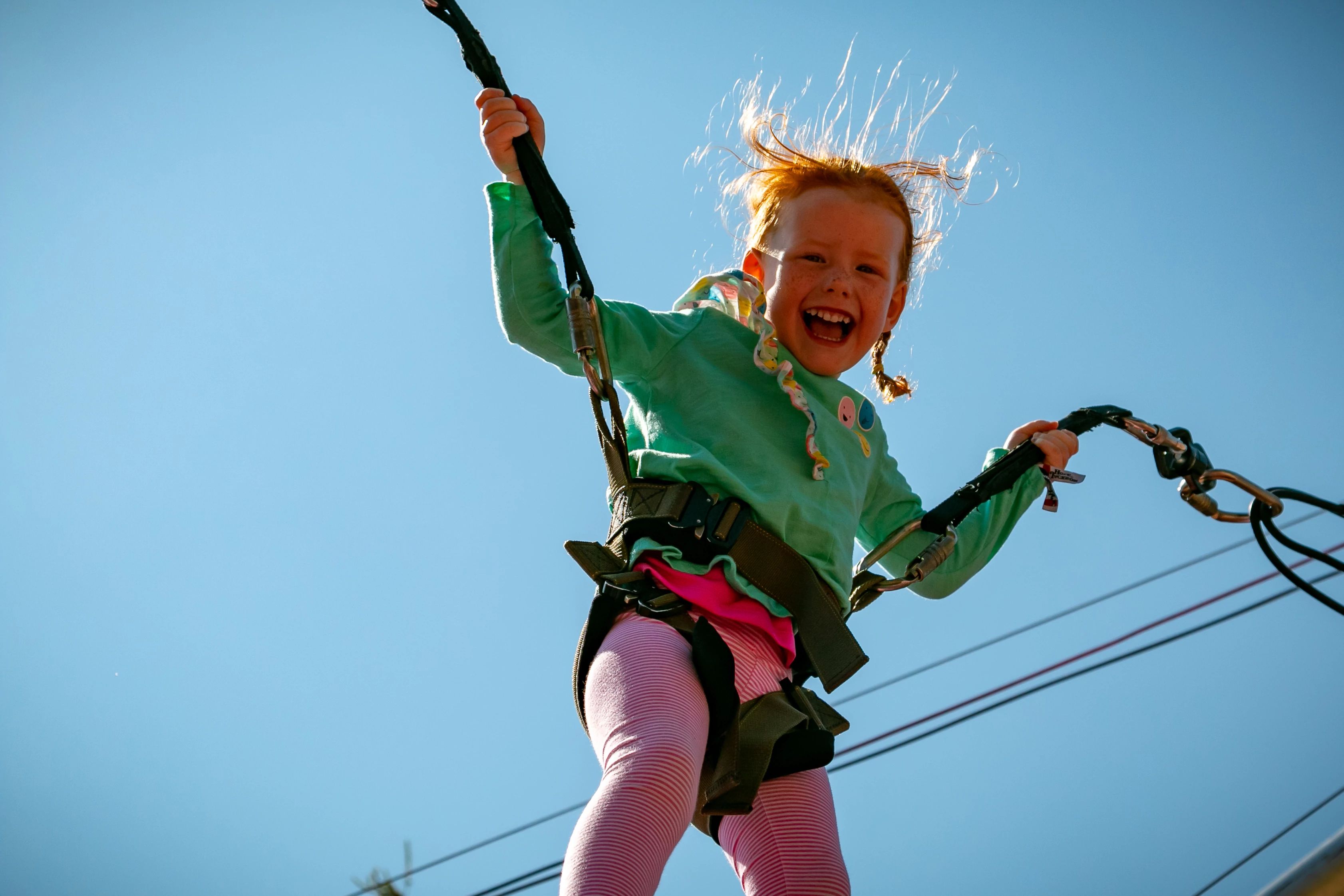 Girl on bungee trampoline