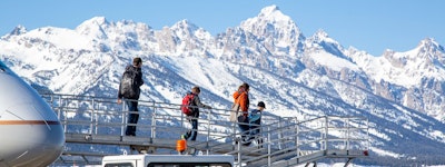 Stepping off the airplane to see the beautiful snowy teton mountain range