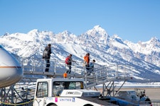 Stepping off the airplane to see the beautiful snowy teton mountain range