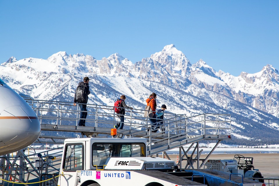 Stepping off the airplane to see the beautiful snowy teton mountain range