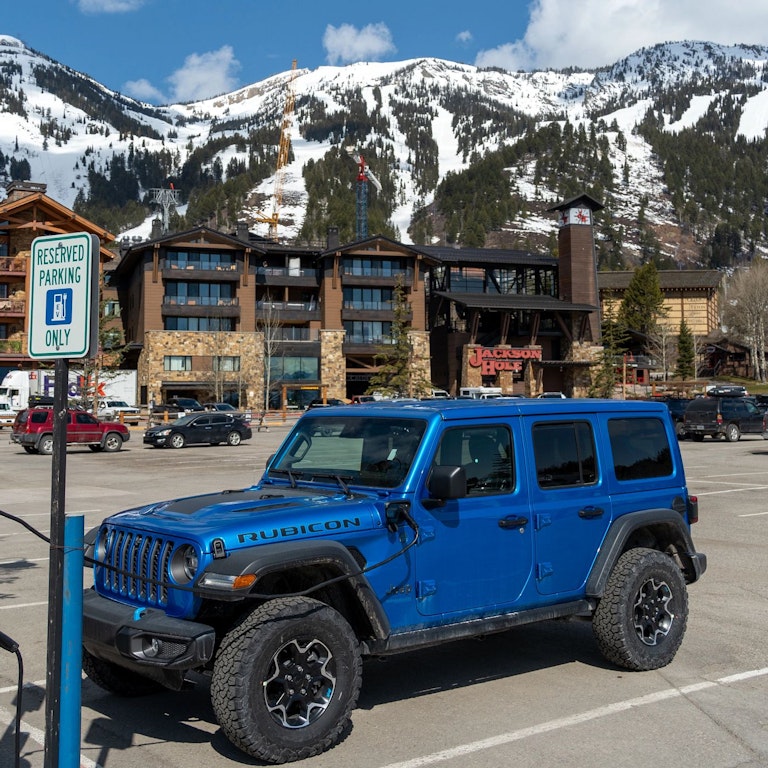 A Jeep using an electric charging station in Teton Village