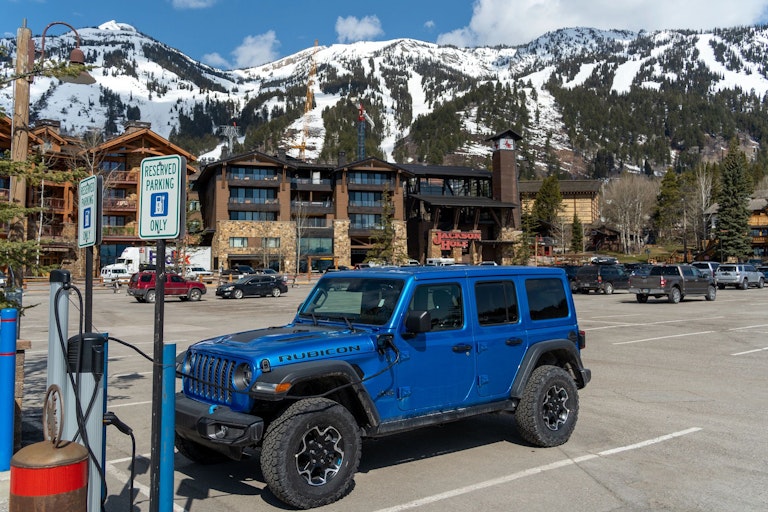 A Jeep using an electric charging station in Teton Village