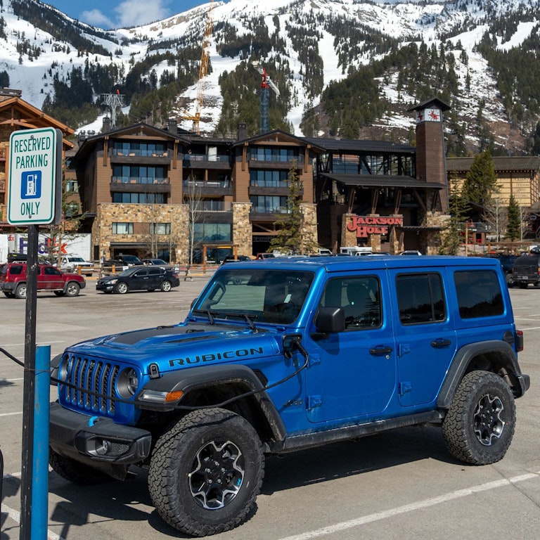 A Jeep using an electric charging station in Teton Village