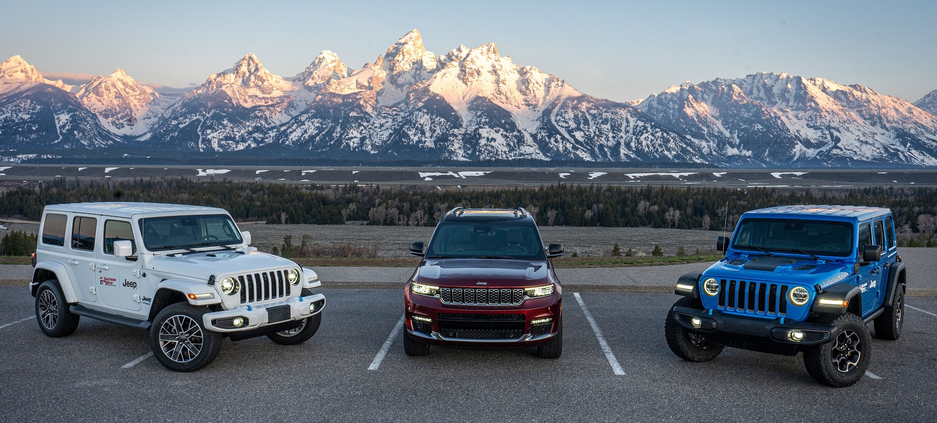 Three Jeeps with the Teton mountain range in background
