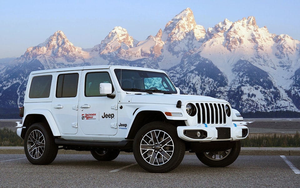 Three Jeeps with the Teton mountain range in background