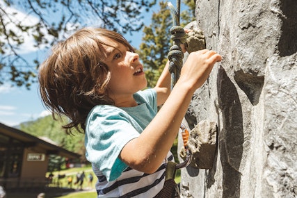 Boy climbing on the climbing wall
