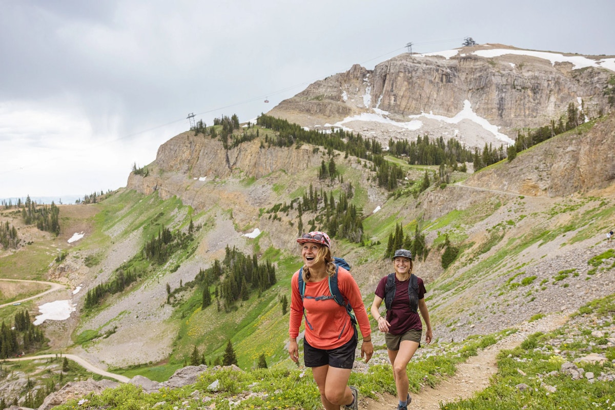 Two people hiking in Teton Village