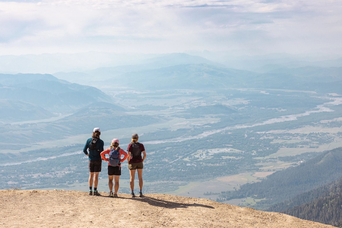 Three hikers looking out at the beautiful view