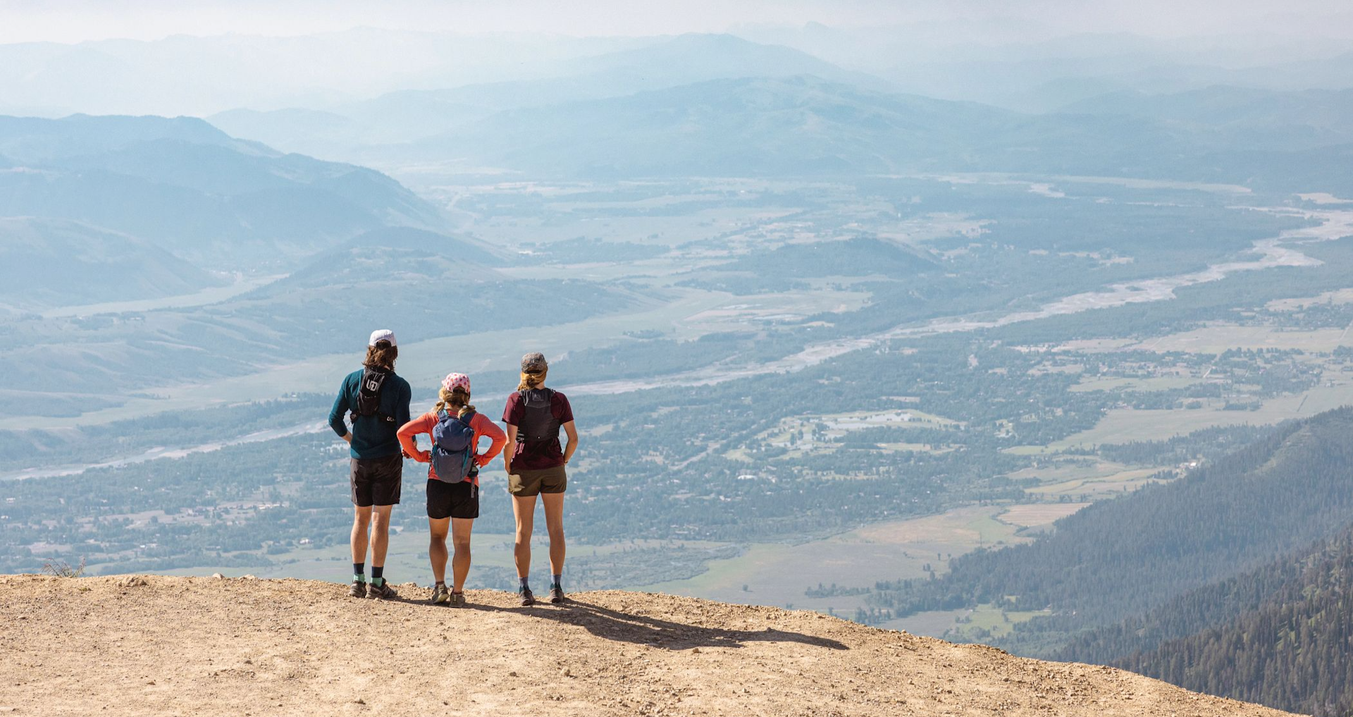 Three hikers looking out at the beautiful view
