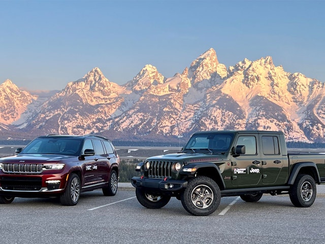 Jeeps in front of the Teton range