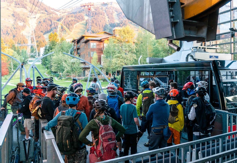 Bikers  getting ready to load the tram