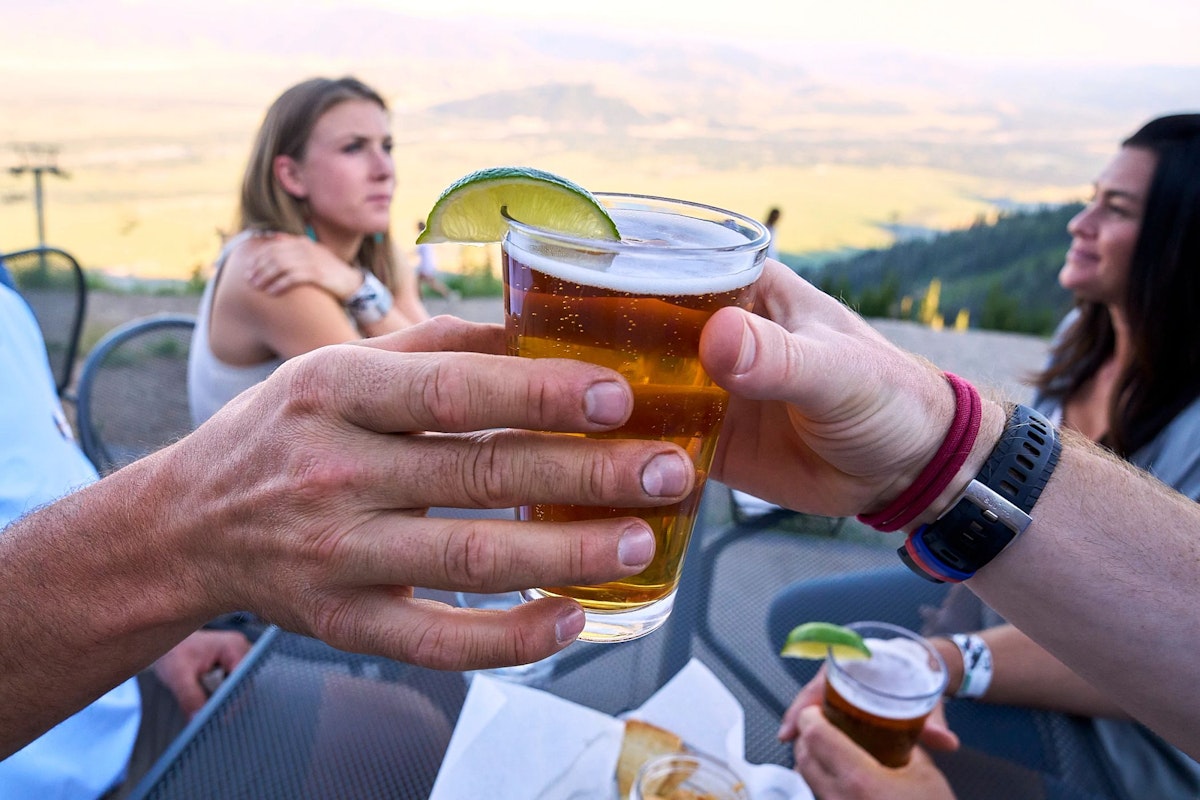 Passing a beer on The Deck