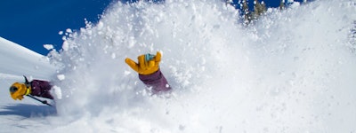 Skier in extremely deep powder