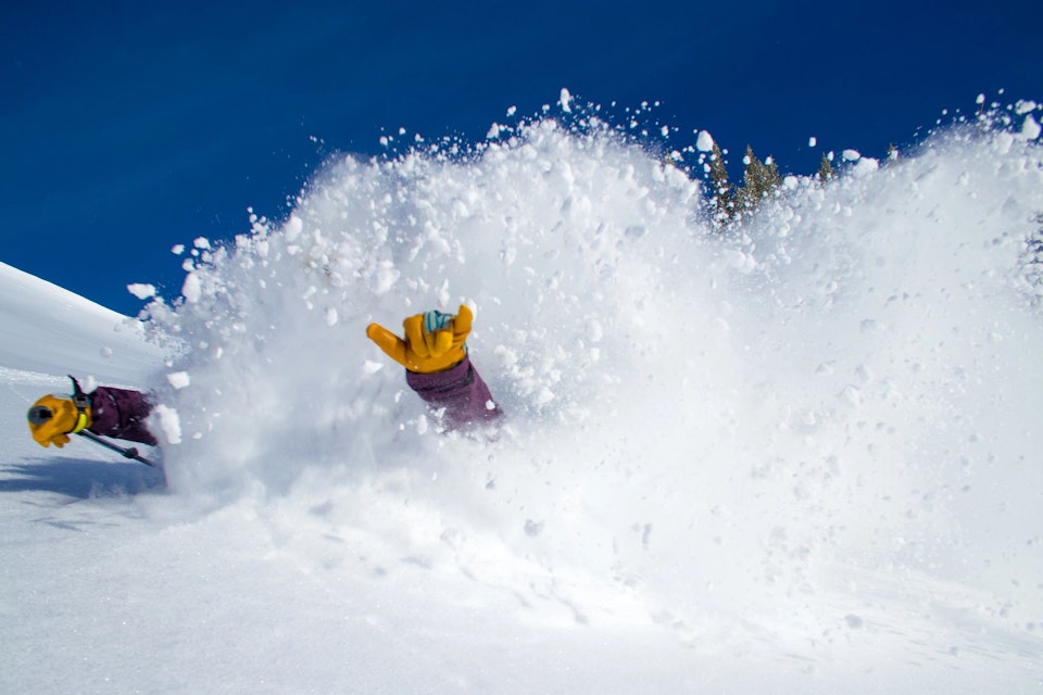 Skier in extremely deep powder