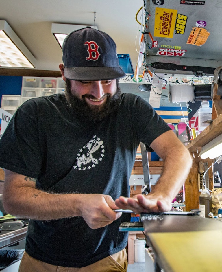 Man waxing skis