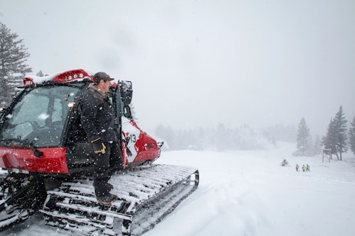 Employee stepping outside snowcat