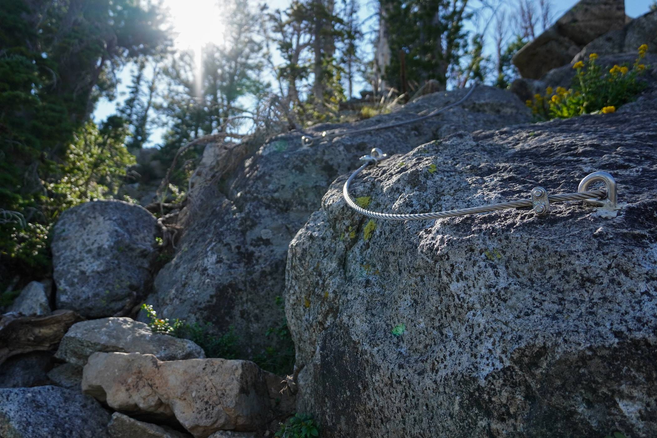 Metal wires along rock on Holey Moley