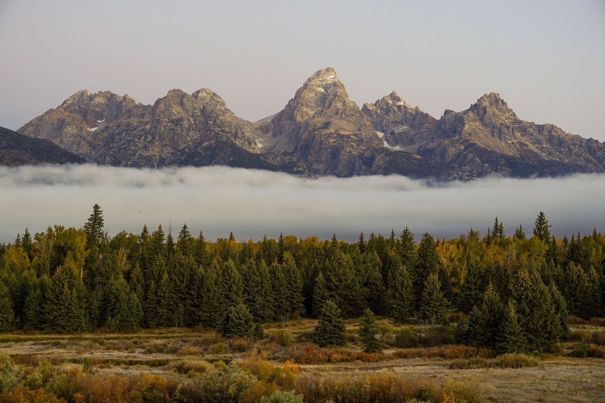 The Teton Range in the fall during an inversion