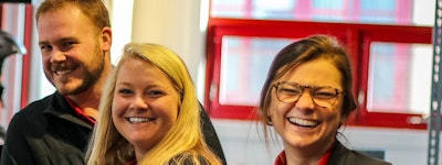 Three employees smiling
