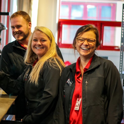 Three employees smiling