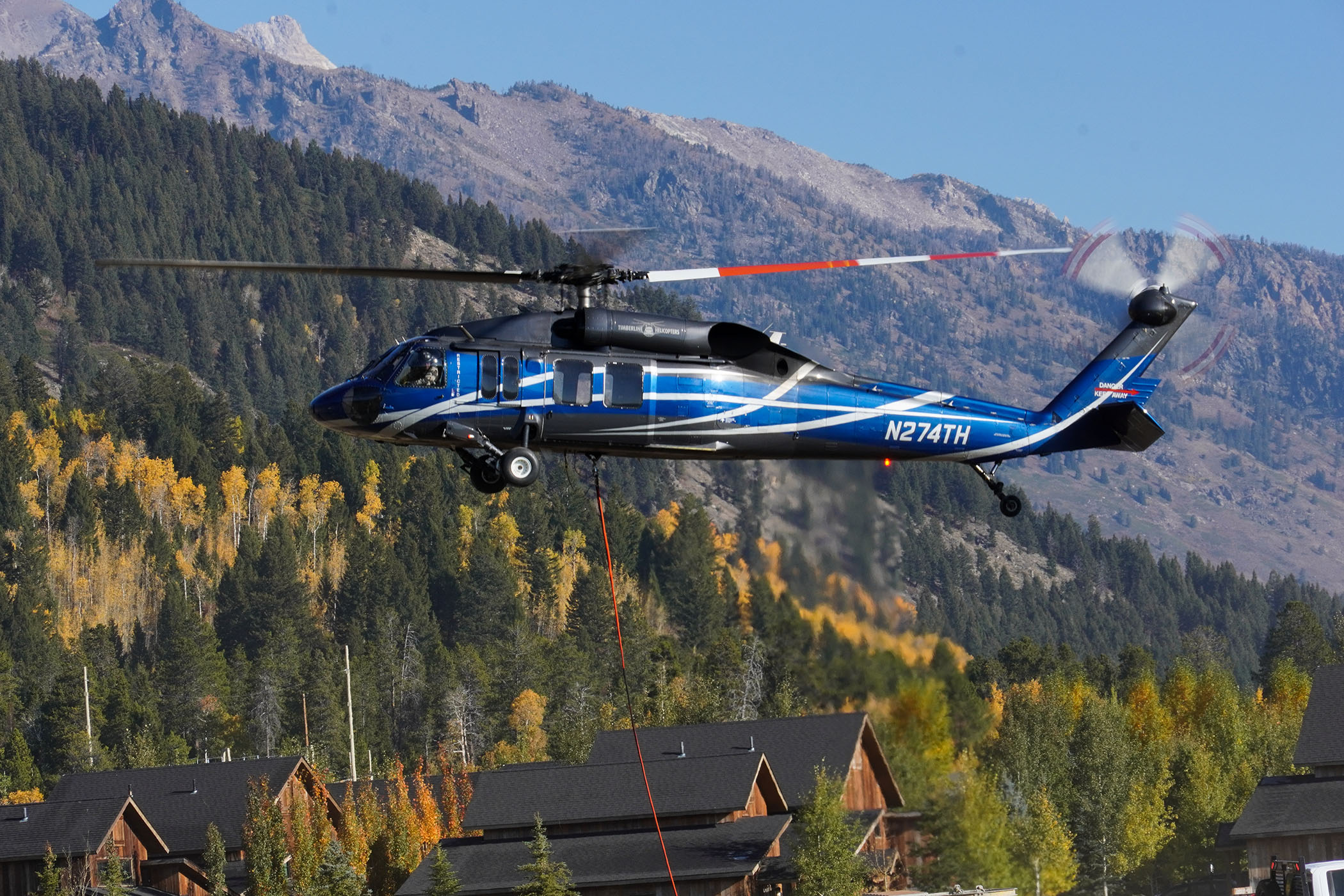 Helicopter getting ready to carry parts to mountain