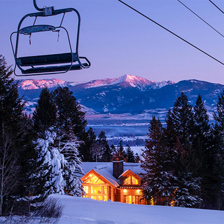 Slopeside lidge with chairlift in foreground
