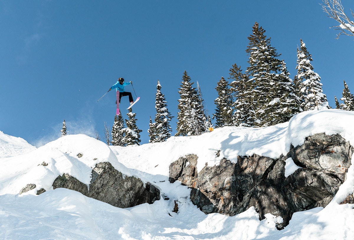 Skier getting a lot of air off a small cliff