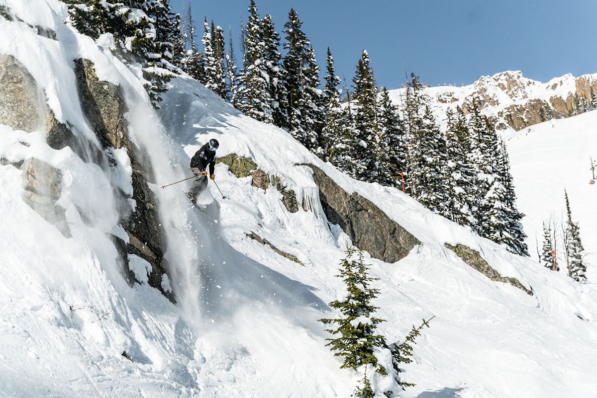 Skier going off a cliff